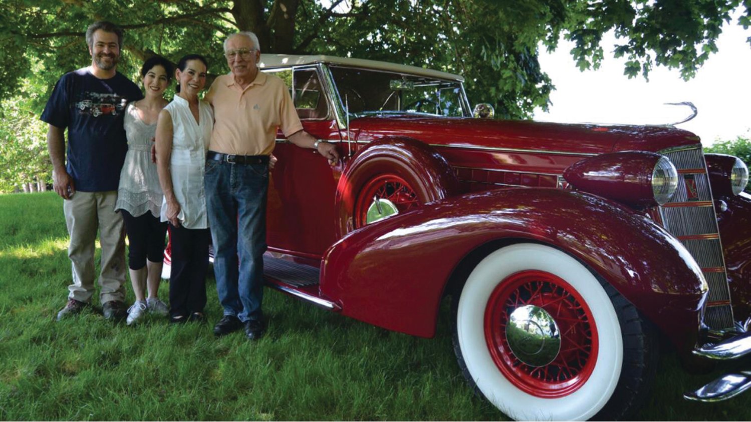 FAMILY AFFAIR: John Ricci poses for a photo with his fully restored 1934 Cadillac and his wife, Donna, and children, Jennifer and John Michael.